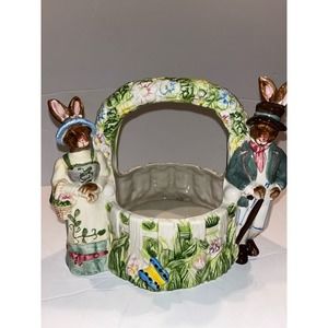 Unbranded ceramic Mr and Mrs Easter Bunny standing by the wishing Well Garden